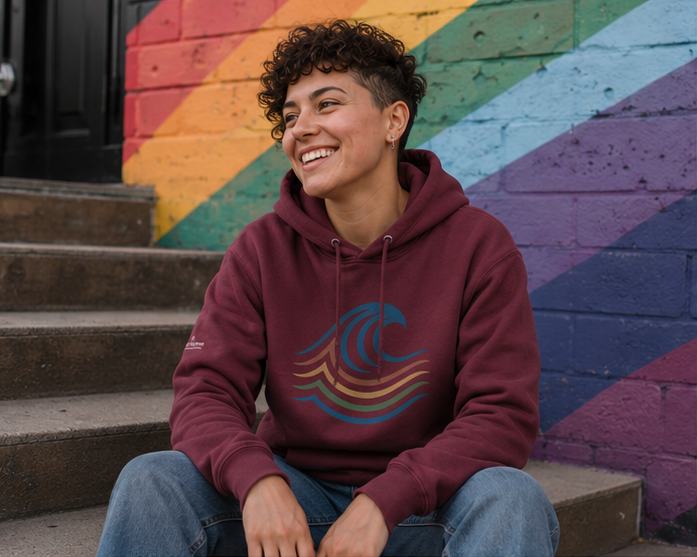 BreakWater Hoodie at a Pacific Northwest Pride mural stoop — queer-owned PNW Pride apparel, front view