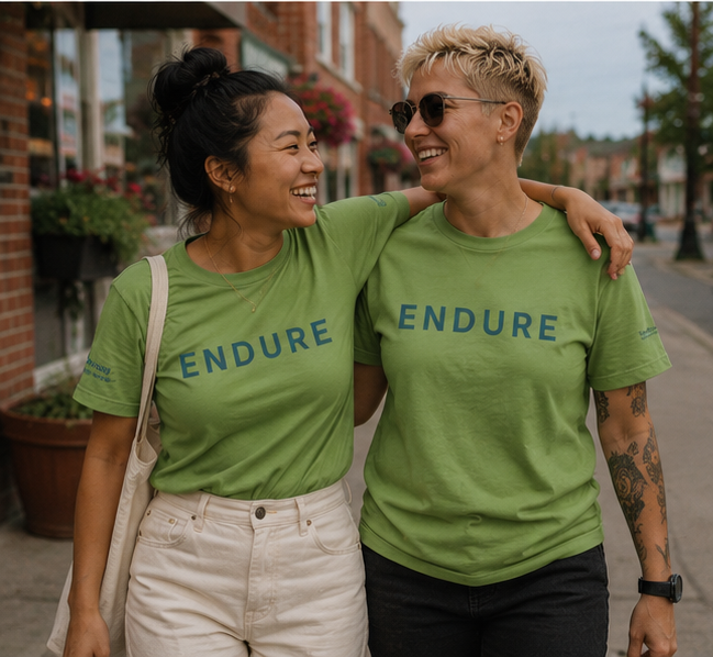 Endure Women's Relaxed T-Shirt at a Pacific Northwest small town — queer-owned PNW Pride apparel, front view