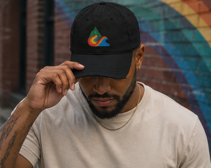 EverProud Logo Minimalist Canvas Cap in an urban Pride mural detail — queer-owned PNW Pride apparel, front view