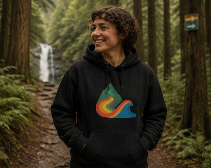 EverProud Logo Minimalist Hoodie at a Pacific Northwest forest trail — queer-owned PNW Pride apparel, front view