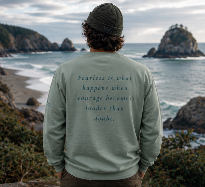 Fearless Sweatshirt on an Oregon coast overlook — queer-owned PNW Pride apparel, back view