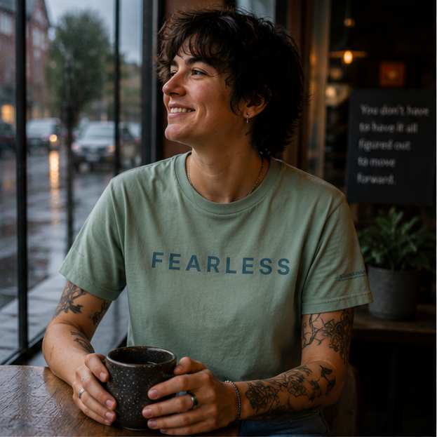 Fearless T-Shirt at a rainy Pacific Northwest coffee shop — queer-owned PNW Pride apparel, front view
