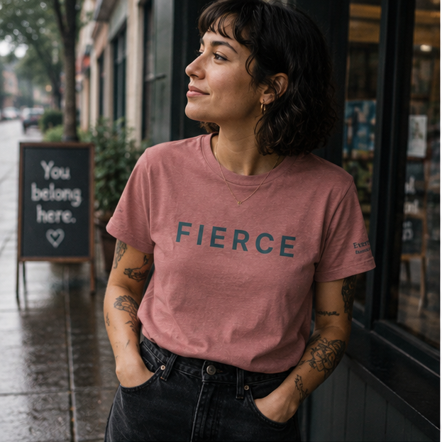 Fierce Women's Relaxed T-Shirt in a rainy Pacific Northwest city street — queer-owned PNW Pride apparel, front view