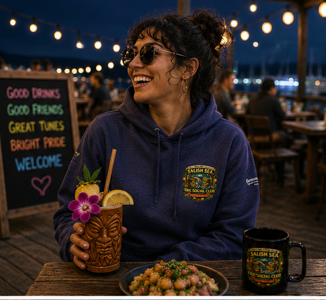 Orca After Dark Hoodie at a Pacific Northwest dockside tiki night — queer-owned PNW Pride apparel, front view