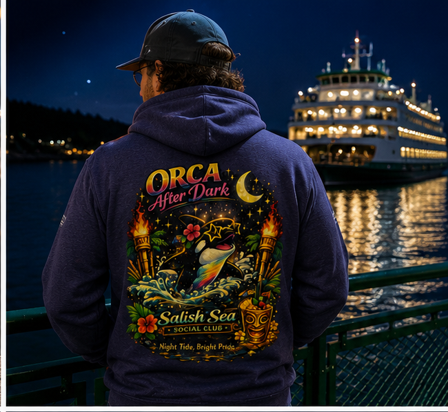 Orca After Dark Hoodie in a Pacific Northwest ferry at night — queer-owned PNW Pride apparel, back view
