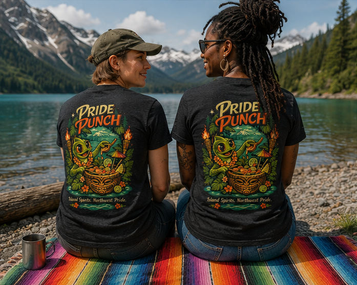 Pride Punch T-Shirt at a BC alpine lake — queer-owned PNW Pride apparel, back view