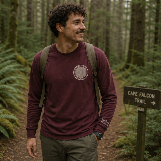 Quiet Rings Long Sleeve Tee at a Pacific Northwest forest trail — queer-owned PNW Pride apparel, front view