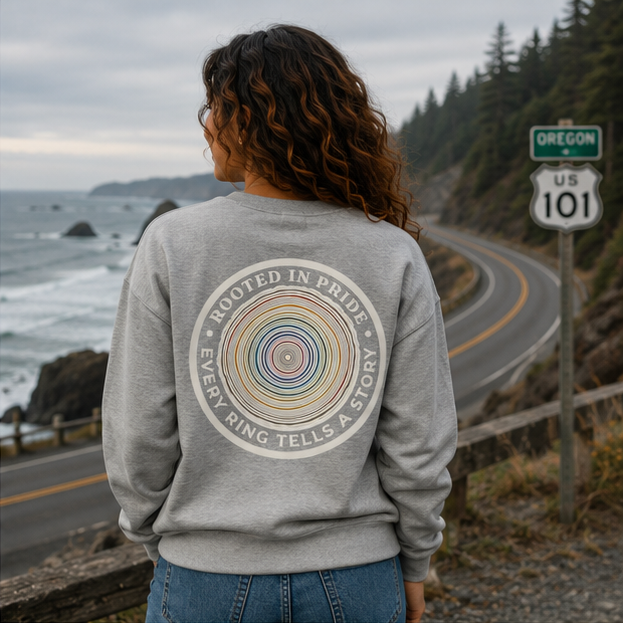 Quiet Rings Sweatshirt on Oregon Coast Highway 101 — queer-owned PNW Pride apparel, back view