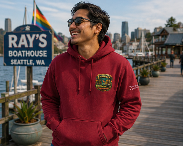 Rainbow Rum Hoodie on the Seattle waterfront — queer-owned PNW Pride apparel, front view