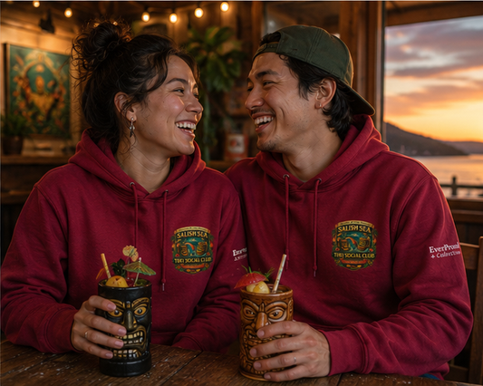 Rainbow Rum Hoodie at a cozy retro tiki lounge — queer-owned PNW Pride apparel, front view