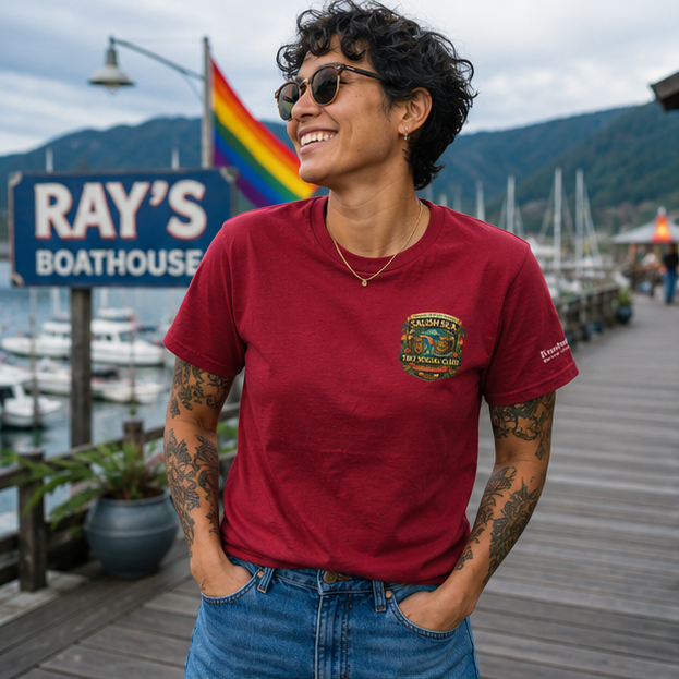 Rainbow Rum T-Shirt at a Pacific Northwest marina boardwalk — queer-owned PNW Pride apparel, front view