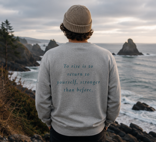 Rise Sweatshirt on a Pacific Northwest coastal overlook — queer-owned PNW Pride apparel, back view