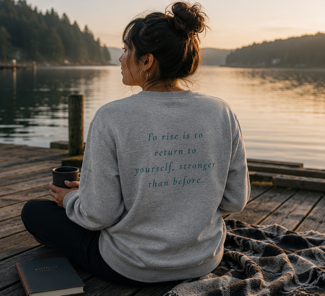 Rise Sweatshirt at a Pacific Northwest lakeside dock — queer-owned PNW Pride apparel, back view