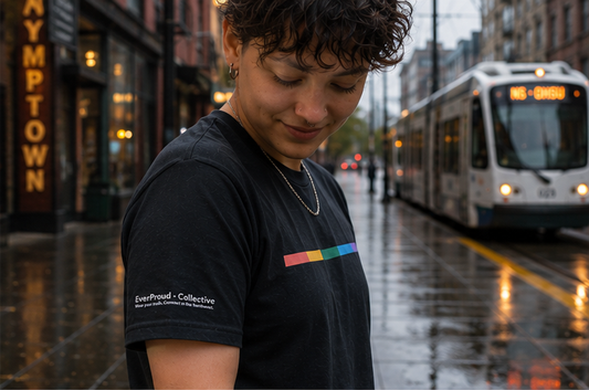 Signal Core T-Shirt at a Portland streetcar stop, sleeve detail — queer-owned PNW Pride apparel, front view