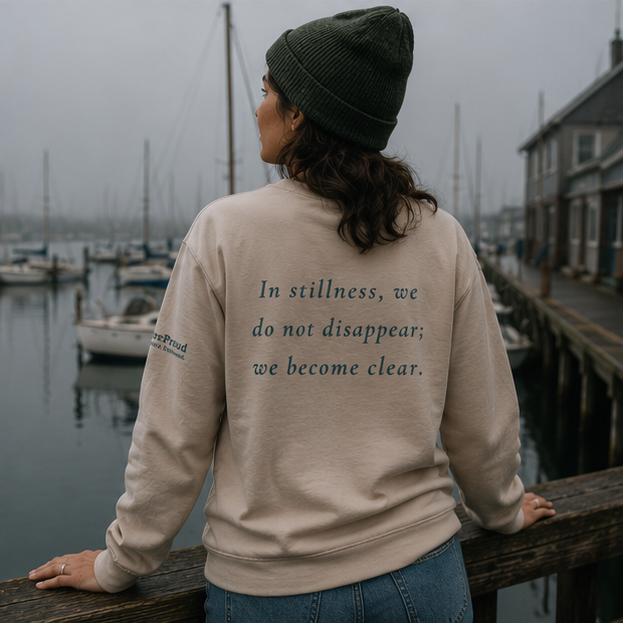 Still Sweatshirt at a foggy Pacific Northwest marina — queer-owned PNW Pride apparel, back view with inspirational quote