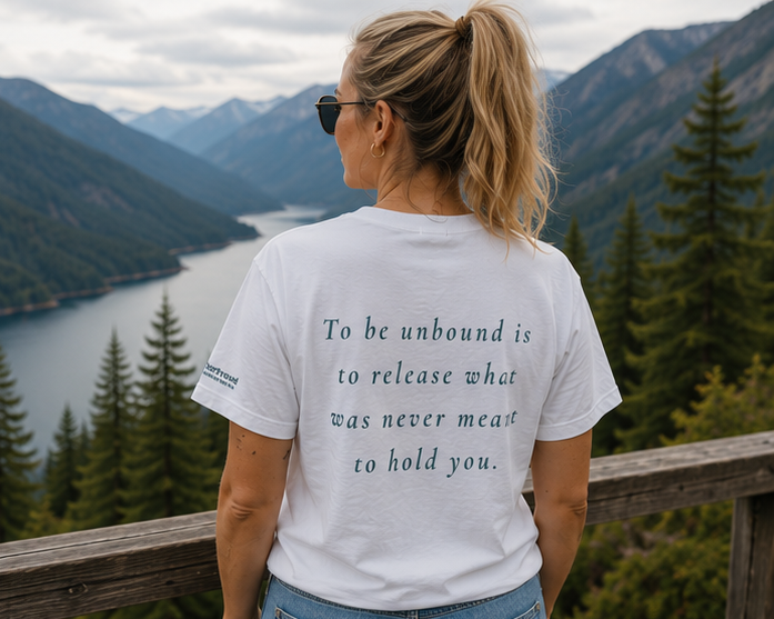 Unbound T-Shirt at a misty mountain lake — back view with inspirational quote, PNW Pride apparel