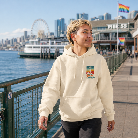 Where the Sound Meets the Sky Hoodie at Pier 55 waterfront — queer-owned PNW Pride apparel, front view
